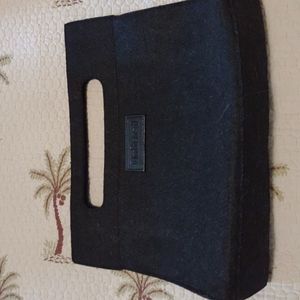 Unlisted black clutch. Medium size